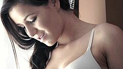 The brunette fetish babe in stockings receives a cumshot on her feet after handjob and blowjob