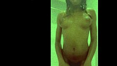 i watch davina bathing in the shower, her wet body glistening