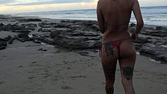 Teen lesbians masturbate to orgasm on the beach, big ass and tits in massage fun.