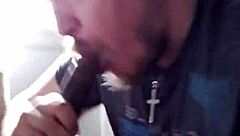 I'm performing a blowjob on a big black cock.