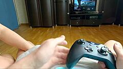 Step-sister gives deep blow job to step-brother while he is playing video games.
