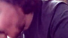 I'm performing a blowjob on a big black cock.