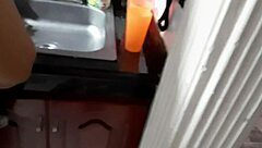 I come back while she is washing the dishes and I make her give me a blow job.