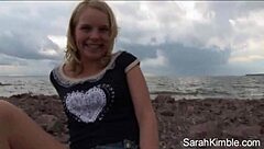 Sweet Sarah Kimble flashes pussy in close-up beach POV scene