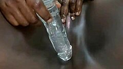 Ebony whore squirts during solo dildo masturbation