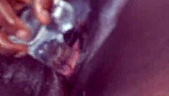 Ebony whore squirts during solo dildo masturbation