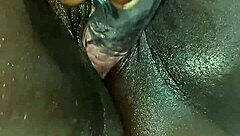 Ebony whore squirts during solo dildo masturbation