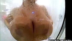seductive nikki benz soaps up big tits in shower