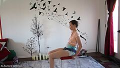 european brunette teaches yoga poses to friend