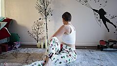 Beautiful girlfriend gets yoga lesson from her friend
