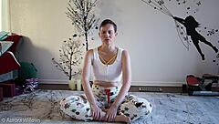 Beautiful girlfriend gets yoga lesson from her friend