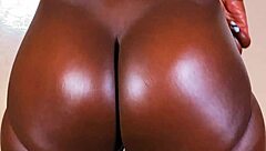 Ebony goddess strips and teases in lingerie.