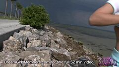 She bares her tiny titties and tight pussy at the beach