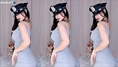 Korean girl dances seductively exposing big tits