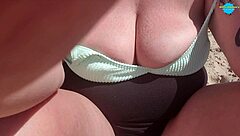 pinky pussy topless on public beach showing hairless shaved pussy and big ass for horny milf reality.