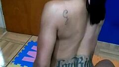 The brunette tattooed girl sits on the console for the first time