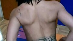 The brunette tattooed girl sits on the console for the first time