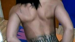 The brunette tattooed girl sits on the console for the first time