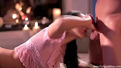 Pretty brunette gives a deep blow job and gets a facial by the fireplace