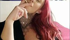 Sensual babe smokes and teases, igniting deep desires in this webcam session