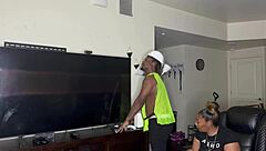 Construction worker kendale assists client on the job