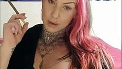 Sensual babe smokes and teases, igniting deep desires in this webcam session