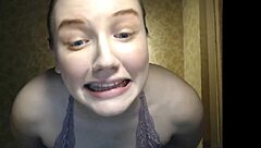 Cute shy girl shows off her big natural tits