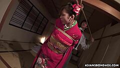 Japanese girl tied up and giving two men oral sex and being teased