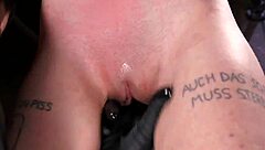 Fetish BDSM scene with small boobied girl being flogged while tied up
