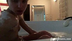 Teen blonde gives footjob in home video