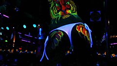 Descriptive of Queen Glow performing in LK Metro with dancing