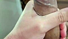 Young Amateur Beats Off with Condom at Home