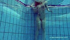 Red-haired Roxalana is sexy and she swims in the sea
