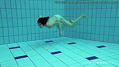 Red-haired Roxalana is sexy and she swims in the sea