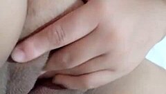 Beautiful Amateur Moans While Fingering Wet Pussy on Bed