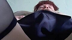 The redhead whore with scarlet nails satisfies her hungry pussy through homemade masturbation