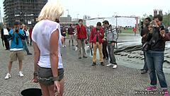 busty blonde bound in wet shirt outdoors