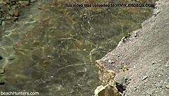 on the beach, an amateur couple engages in passionate sex under the sun