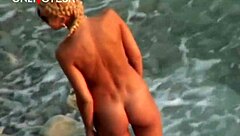 Geez, watching this gorgeous blonde babe ride on public beach is wild!