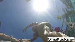 Olivia enjoys nude masturbation in the pool, showing off her big tits and ass