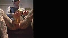 Tattooed guy strokes cock in fleshlight solo