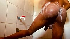 Solo boy enjoys gay bath time while listening to gay porn stars having sex in another room