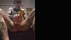 Tattooed guy strokes cock in fleshlight solo