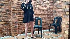 A kinky homemade video of me, a petite amateur, smoking and dancing while I urinate outside