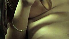 A beautiful brunette enjoys pleasuring herself as she rubs her hairy love nest
