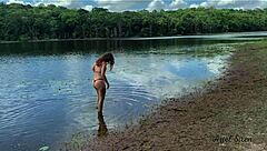 Alternative housewife enjoys a hot bath in the river