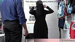 Petite Muslim teen hides stolen goods under her clothes