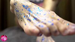 Watch this babe give a sensual footjob to a rubber cock.