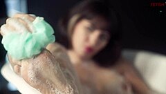 Big-chested blonde gets wet and wild in solo scene
