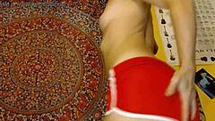 Girl teases by fondling package with toys and dildo in shorts